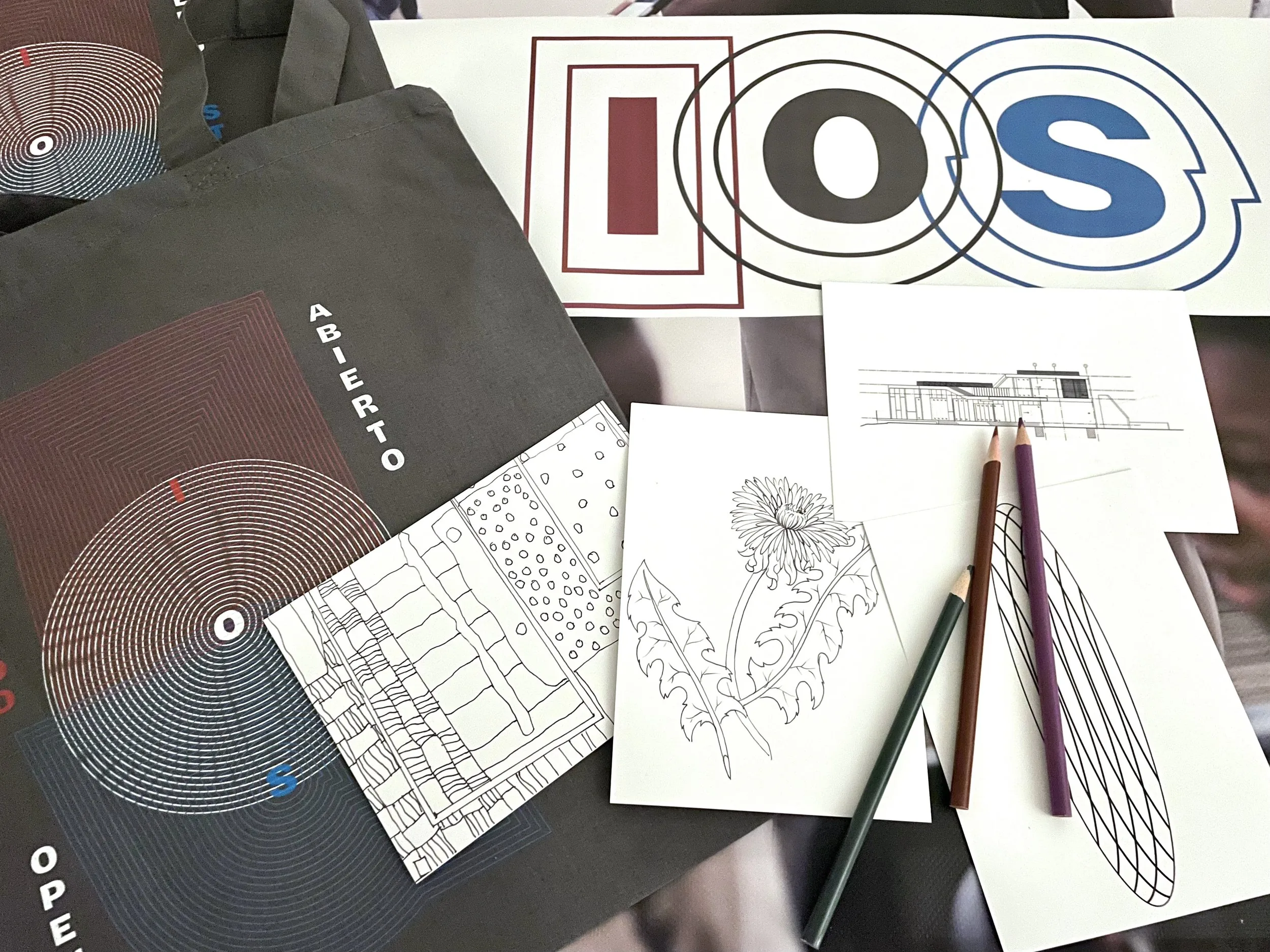 IOS coloring workshop supplies and printed materials arranged on a table