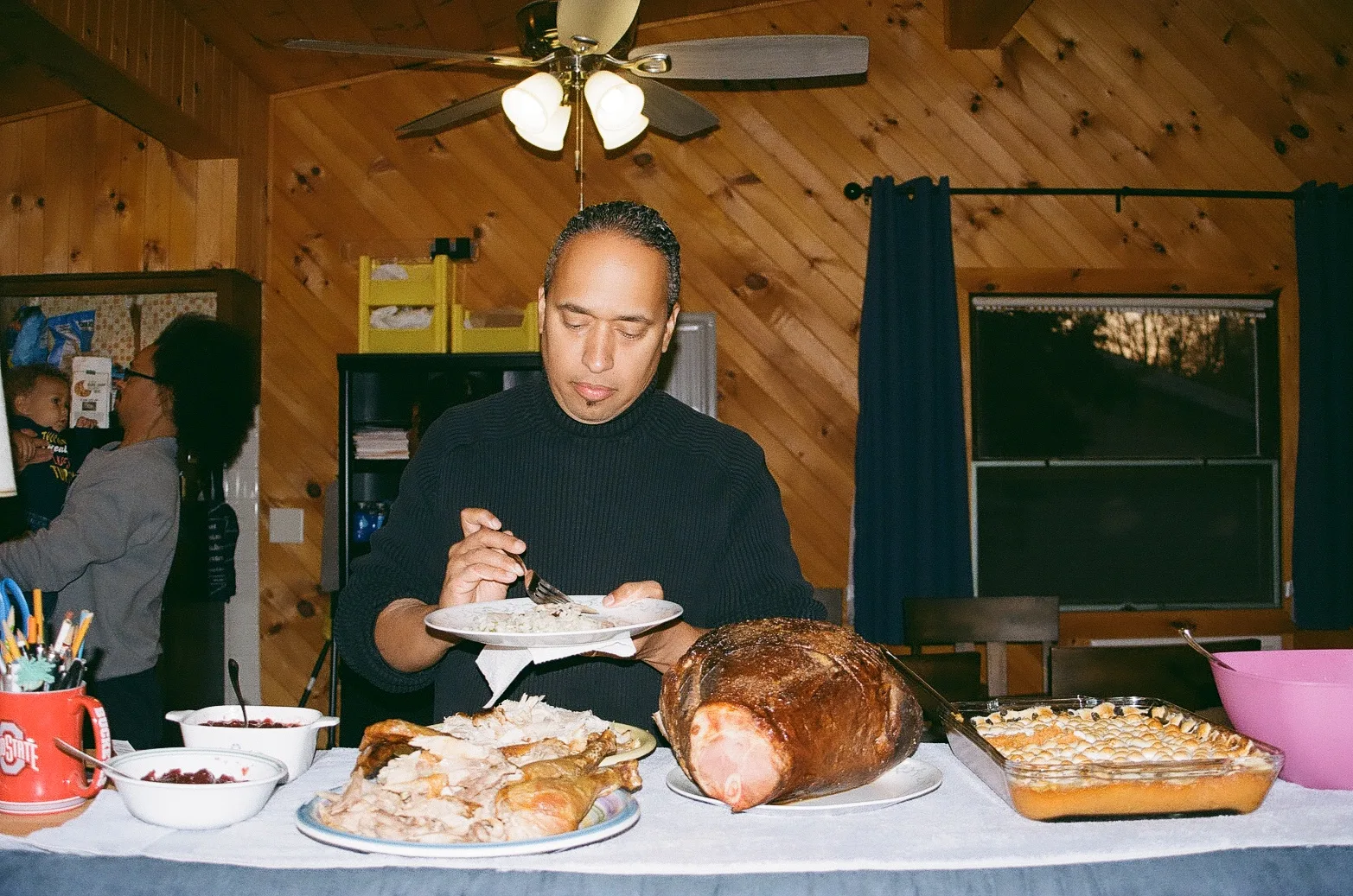 My father in his parents home his adolescent home in 2024, shot on 35mm film.